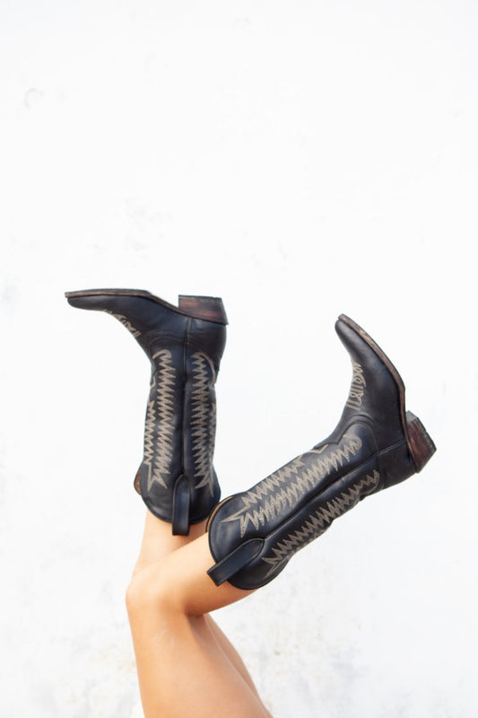 balm wears cowboy boot black