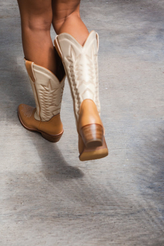 balm wears cowboy boot date shake