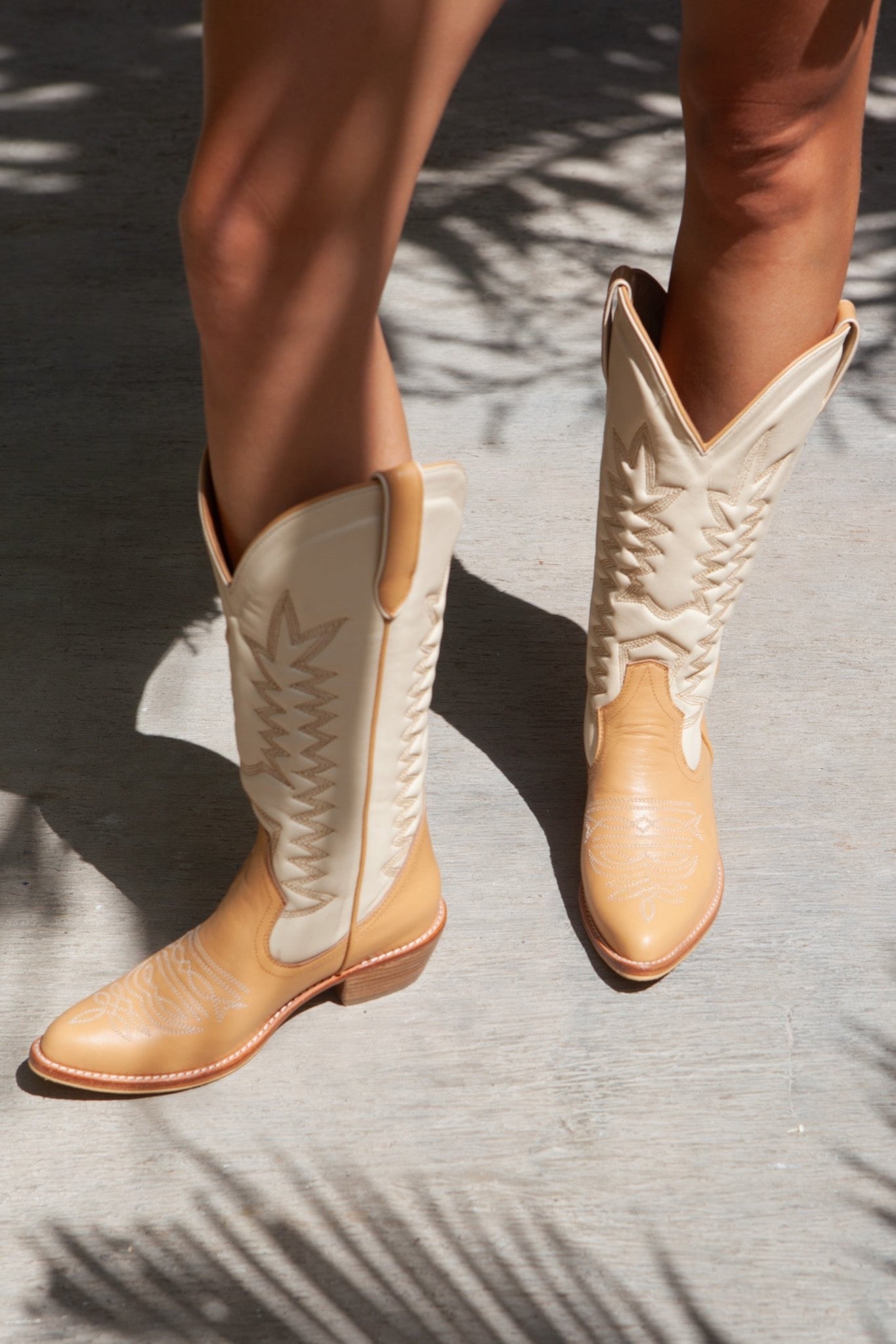 balm wears cowboy boot date shake